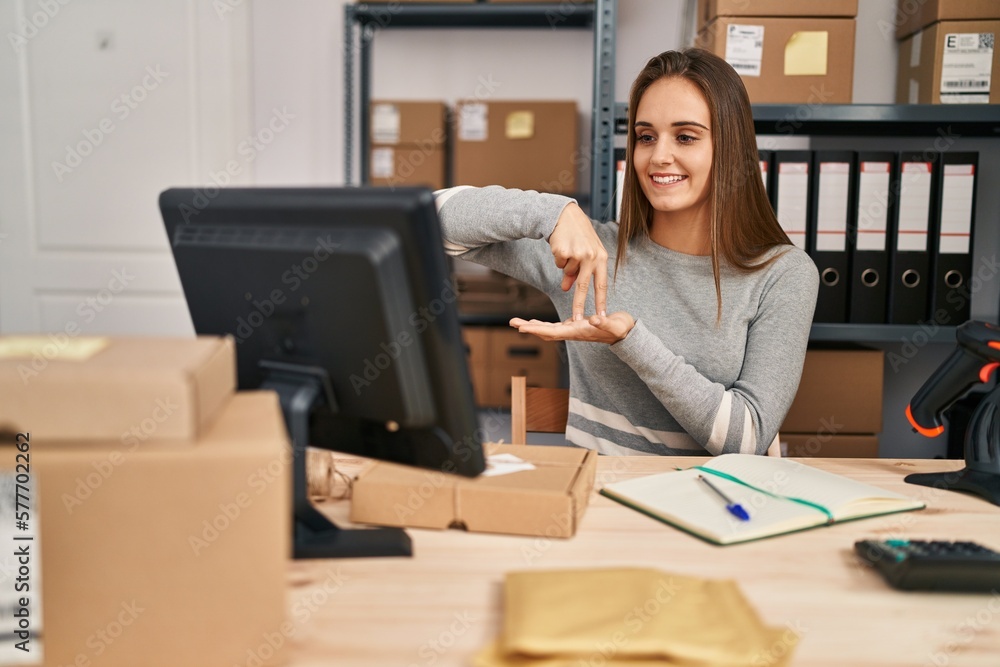 Young blonde woman ecommerce business worker having online deaf language conversation at office Young blonde woman ecommerce business worker having online deaf language conversation at office