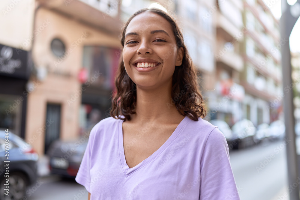 Young african american woman smiling confident standing at street