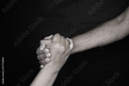 Giving a helping hand. help through a tough time. rescue gesture. support, friendship, and salvation concept