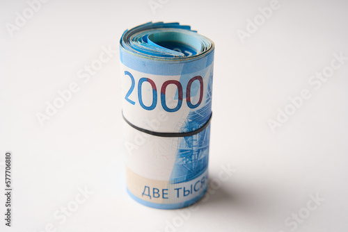 Russian money roll ruble on a white background