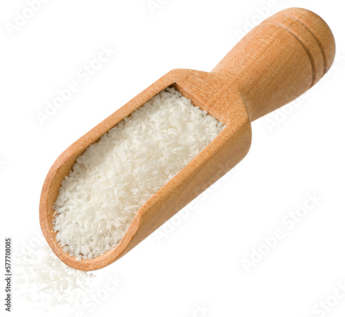 Shredded coconut in the wooden scoop isolated on the white background.