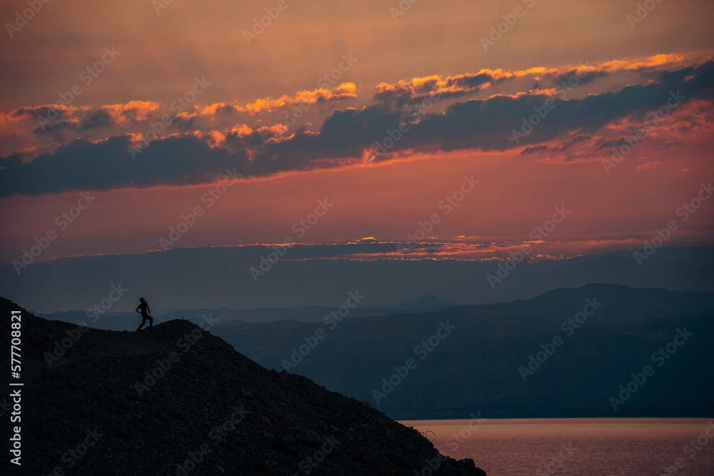 Man on Hill Looking at Dead Sea at Sunset, Jordan