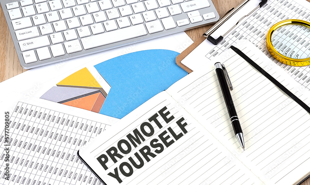 PROMOTE YOURSELF text on a paper on chart background PROMOTE YOURSELF text on a paper on chart background