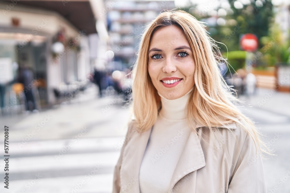 Young blonde woman smiling confident standing at street Young blonde woman smiling confident standing at street