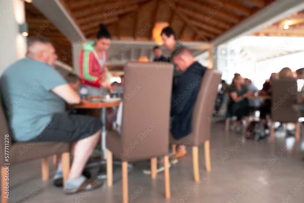 Blurred Shot Of Beach Cafe Where People Eat.