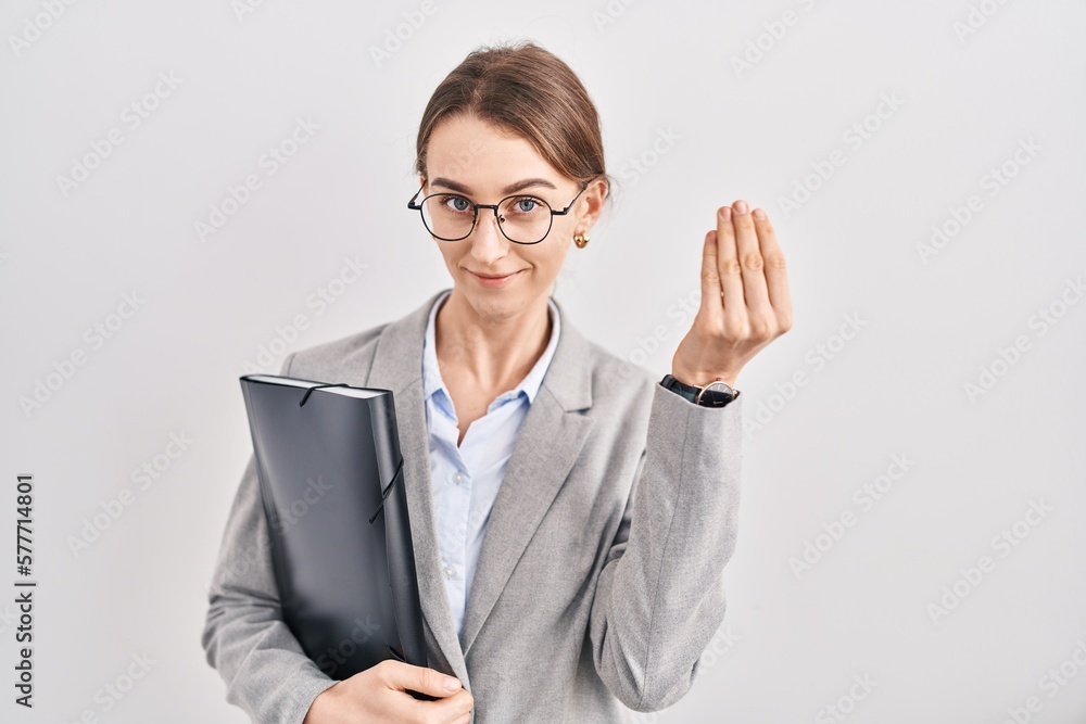 Young caucasian woman wearing business clothes and glasses doing italian gesture with hand and fingers confident expression Young caucasian woman wearing business clothes and glasses doing italian gesture with hand and fingers confident expression