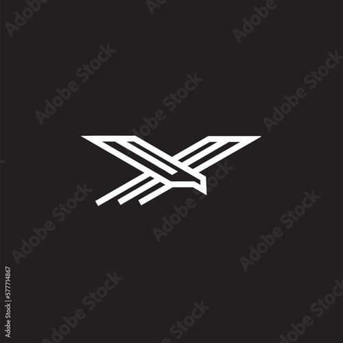 Eagle logo. The logo is made with an eagle with outstretched wings incorporated into the design. Color is white .