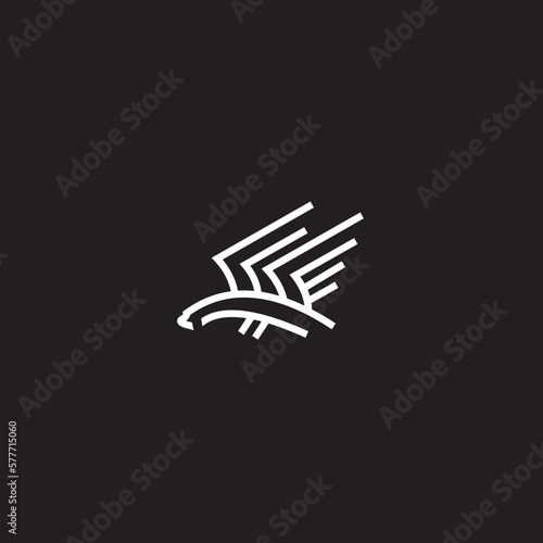Eagle logo. The logo is made with an eagle with outstretched wings incorporated into the design. Color is white .