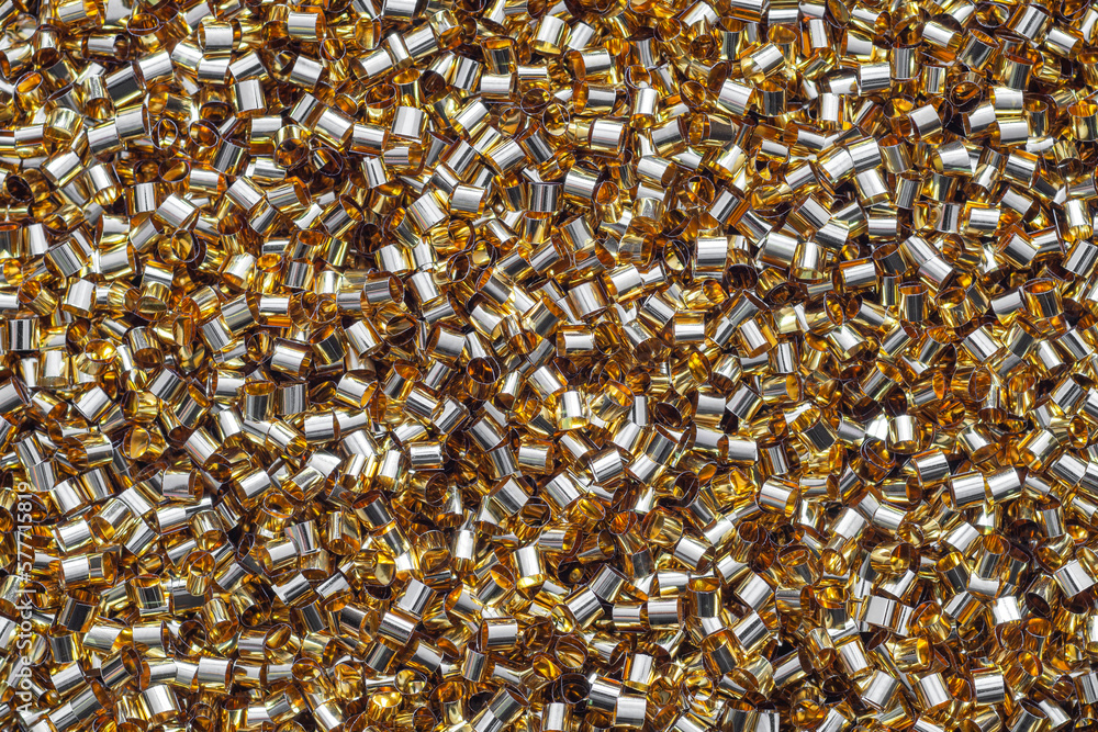 Golden decorative shreds. Background from shredded gold metallic foil Golden decorative shreds. Background from shredded gold metallic foil