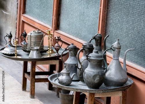 Metal jugs and various traditional Turkish dishes at a flea market in Istanbul.
