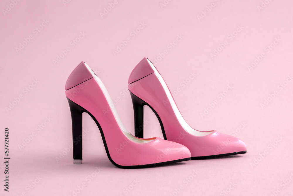 Pink shoes on a pink background. Minimal art poster. Pink shoes on a pink background. Minimal art poster.