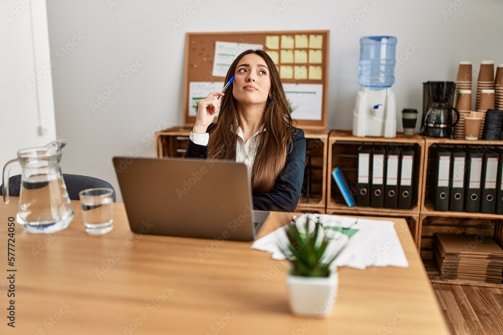 Young hispanic woman business worker using laptop working at office Young hispanic woman business worker using laptop working at office