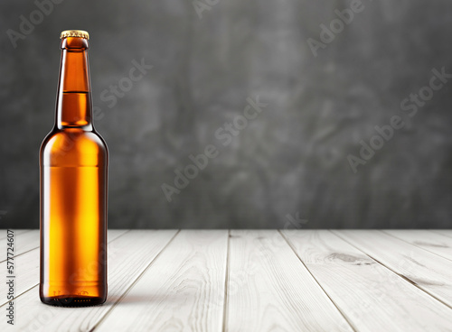 Golden bottle of beer on wooden background