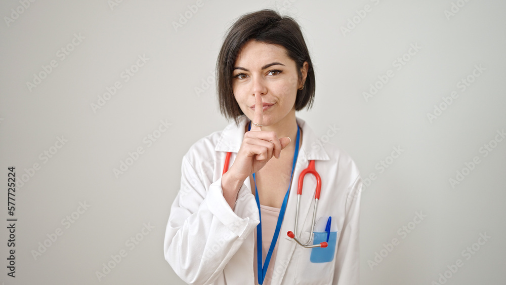 Young caucasian woman doctor asking for silent over isolated white background Young caucasian woman doctor asking for silent over isolated white background