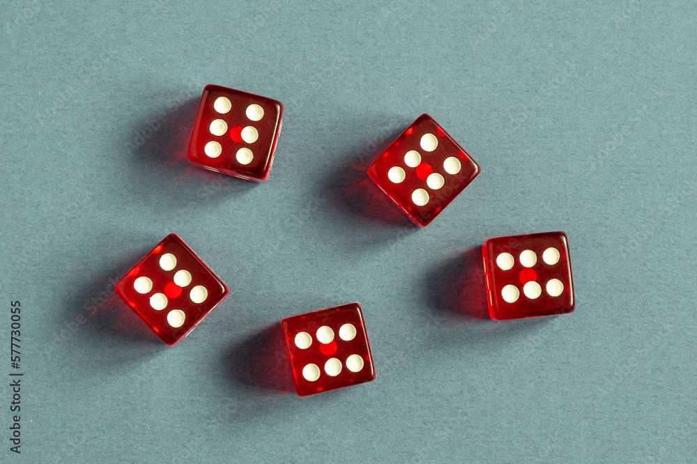 Random number generator. Five red dice with numerical values lie in a chaotic order. Random number generator. Five red dice with numerical values lie in a chaotic order.