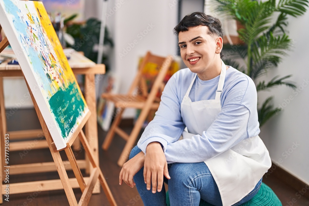 Fototapeta premium Young non binary man artist smiling confident drawing at art studio