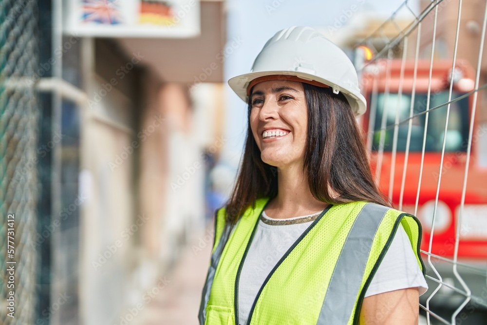 Young beautiful hispanic woman architect smiling confident standing at street Young beautiful hispanic woman architect smiling confident standing at street