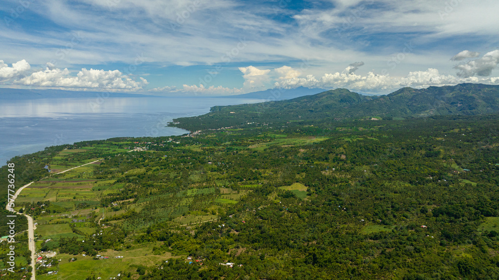 Fototapeta premium Aerial drone of coastline of Negros Island with towns and villages. Philippines.