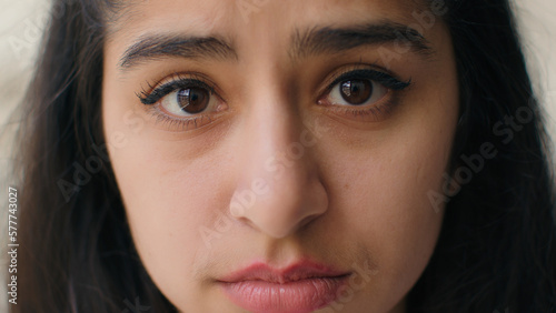 Close up woman sad face with big eyes anxious upset frustrated young teen girl businesswoman feel stress worry relations problem depression shame sorrow. Front head portrait female victim of bullying