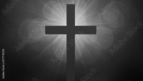 Jesus Christ risen. Cross surrounded by sun rays. Easter and resurrection concept. Black and white tones with bokeh © assistant