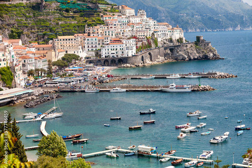 Amalfi, Salerno. Panorama della città sul porto passeggeri con barche  photo