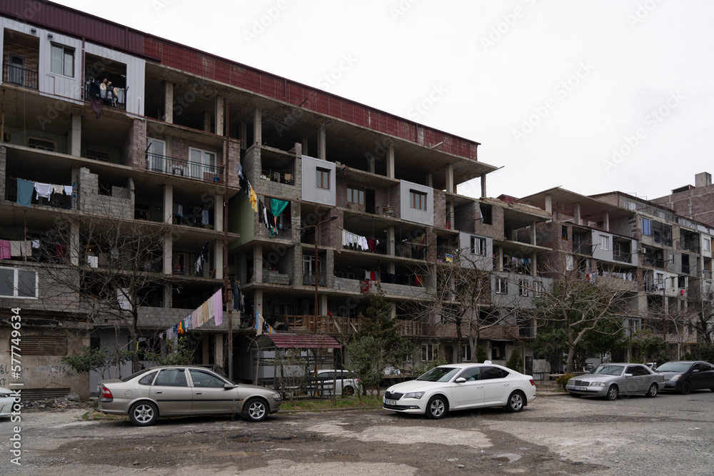 Batumi, Georgia - March 3, 2023: unfinished apartment building in which people live