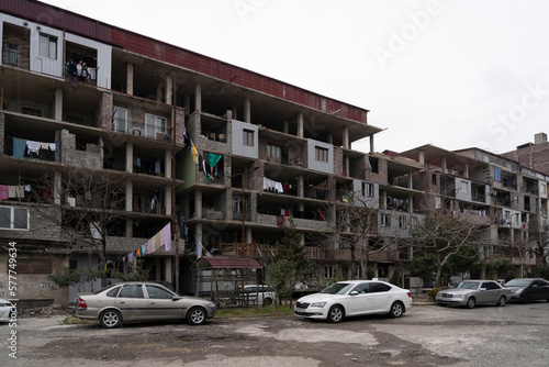 Batumi, Georgia - March 3, 2023: unfinished apartment building in which people live © Dmitrii