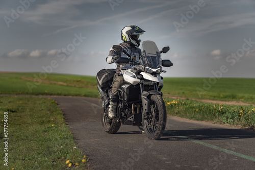 Landscape with motorcycle rider on the road © Trail Patrol