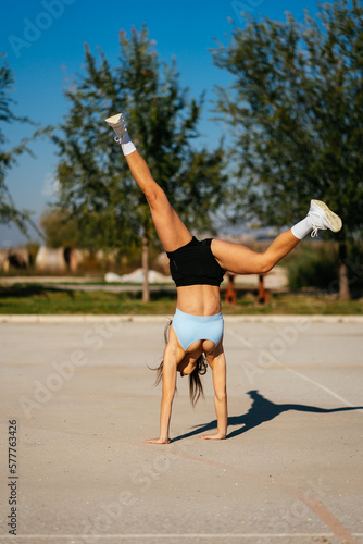 Flexible girl standing on her hands