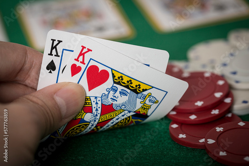 Tableau sur toile Closeup of hands with kings, Texas Hold'em Poker gambling concept