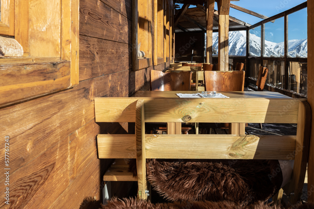 Fragment of a street restaurant with a beautiful view of the mountain landscape on a sunny day, Alps, Austria, Salzburg