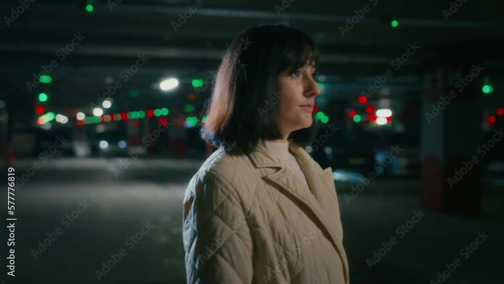 Caucasian woman walk at empty parking lot stand stop looking at camera with sad serious confident unhappy face go away. Millennial Hispanic lady girl female driver businesswoman walking at underground Caucasian woman walk at empty parking lot stand stop looking at camera with sad serious confident unhappy face go away. Millennial Hispanic lady girl female driver businesswoman walking at underground