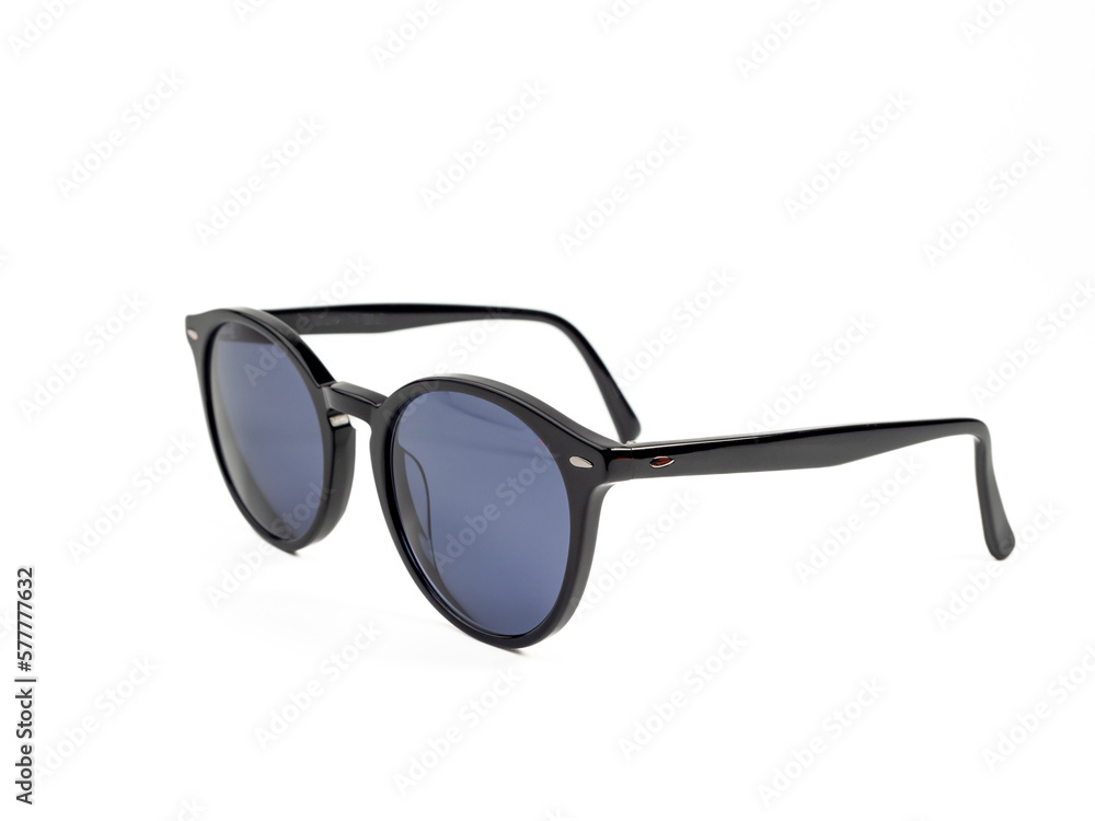 Stylish sunglasses. Sunglasses in a dark frame on a white background. Close-up.