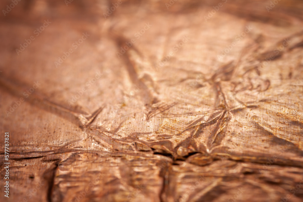 Extreme closeup of crumpled brass foil texture Extreme closeup of crumpled brass foil texture