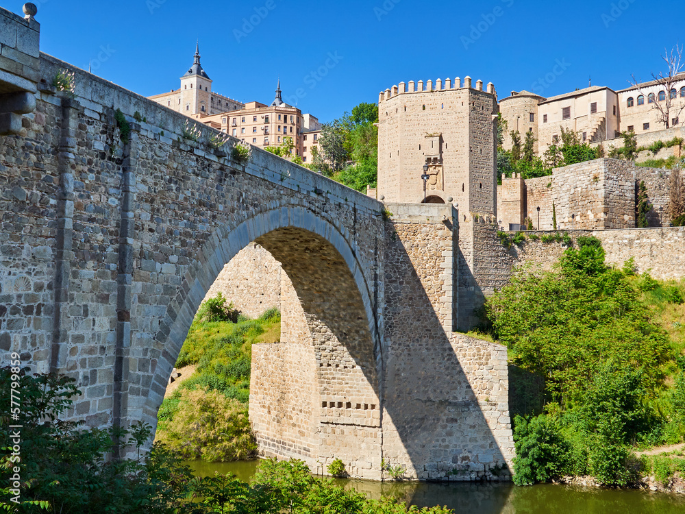 Alcantara bridge, a stone roman arch bridge over Tagus river. Declared national cultural monument, it is an entrace gate to the city of Toledo, with a fortified door. Castilla La Mancha, Spain, Europe