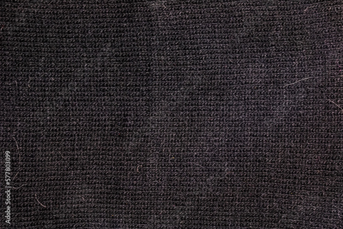 Black texture wool close-up, woven cloth, knitted fabric. © Nataliia
