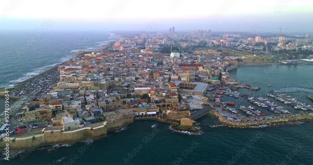 Acre (Akko) is a port city located on the Mediterranean coast and is known for its well-preserved ancient city fortifications. .Aerial footage of the old city, the ancient port and marina. Acre (Akko) is a port city located on the Mediterranean coast and is known for its well-preserved ancient city fortifications. .Aerial footage of the old city, the ancient port and marina.