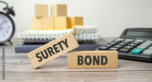 surety bond on the work table and alarm clock
