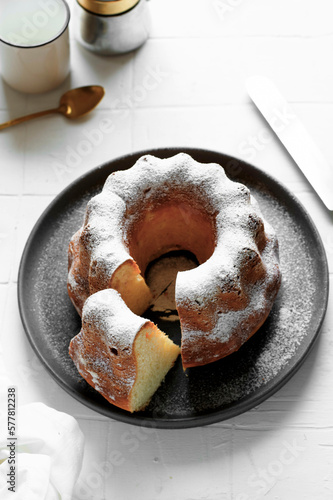 Obraz na plátne Lemon, orange and ricotta bund cake on a white background