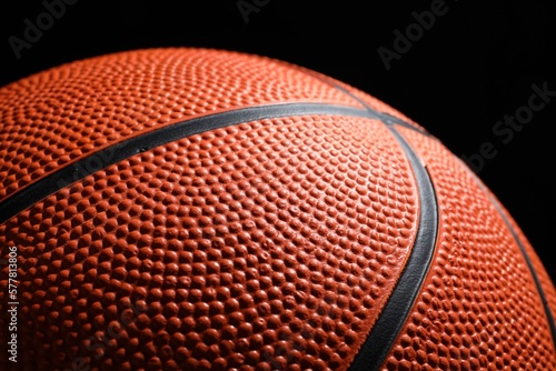 Orange basketball ball on black background, closeup © New Africa