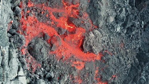 Wallpaper Mural Vertical 9 by 16 view of lava flow from the Hawaii Mauna Loa volcano eruption, 2022 on Big Island. Hot red lava and magma flowing down mountain hill evaporating hazardous dangerous smog air pollution Torontodigital.ca