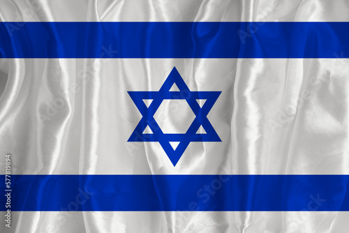 The Israeli flag on a silk background is a great national symbol. Fabric texture The official state symbol of the country.