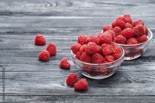 Fototapeta Naklejka Na Ścianę i Meble -  Red raspberries, berries in plates on the table