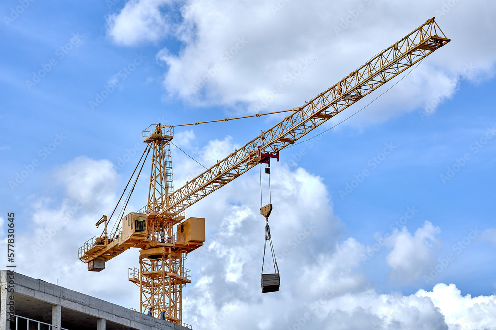 construction crane on a blue sky background. construction crane on a blue sky background.