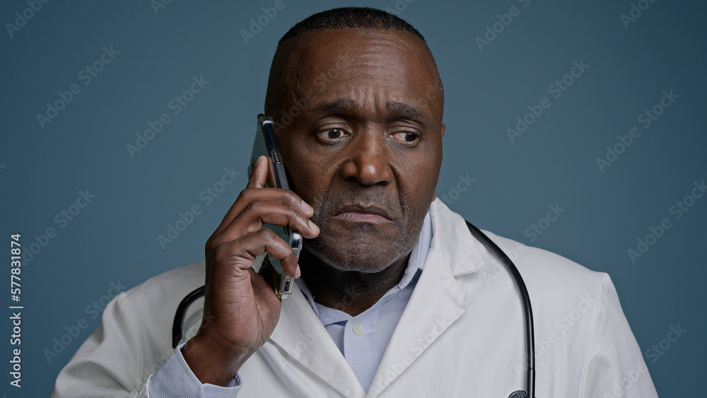 Portrait mature serious man talking on mobile phone focused puzzled confused professional doctor pediatrician therapist remotely communicates with client patient using smartphone discussing symptoms Portrait mature serious man talking on mobile phone focused puzzled confused professional doctor pediatrician therapist remotely communicates with client patient using smartphone discussing symptoms