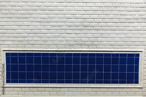 Empty white and blue tiles background for advertisement
