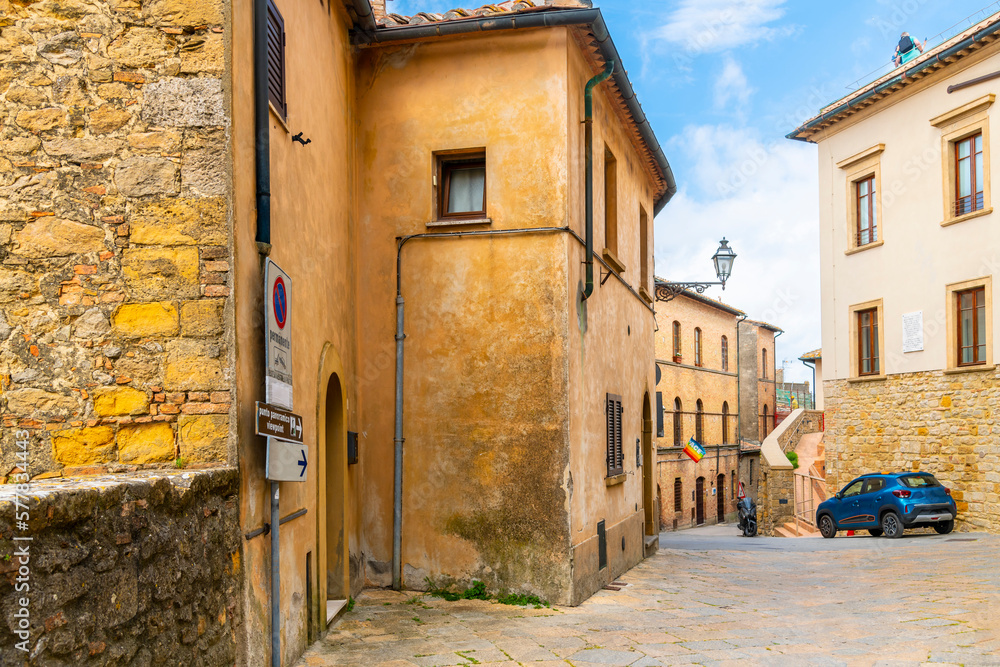 Medieval homes and apartments on one of the historic streets of the hill town of Volterra, Italy, in the Tuscany region.	