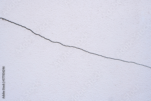 cracked house wall cement background photo