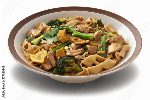 Pad see ew is a popular Thai stir-fried noodle dish made with wide rice noodles, eggs, soy sauce, and a variety of vegetables such onions, broccoli, and carrots.