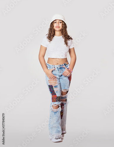 Adorable teen girl modeling studio photoshoot, fashion for teenagers concept